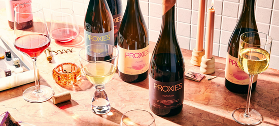 An array of non-alcoholic wines on a kitchen counter.